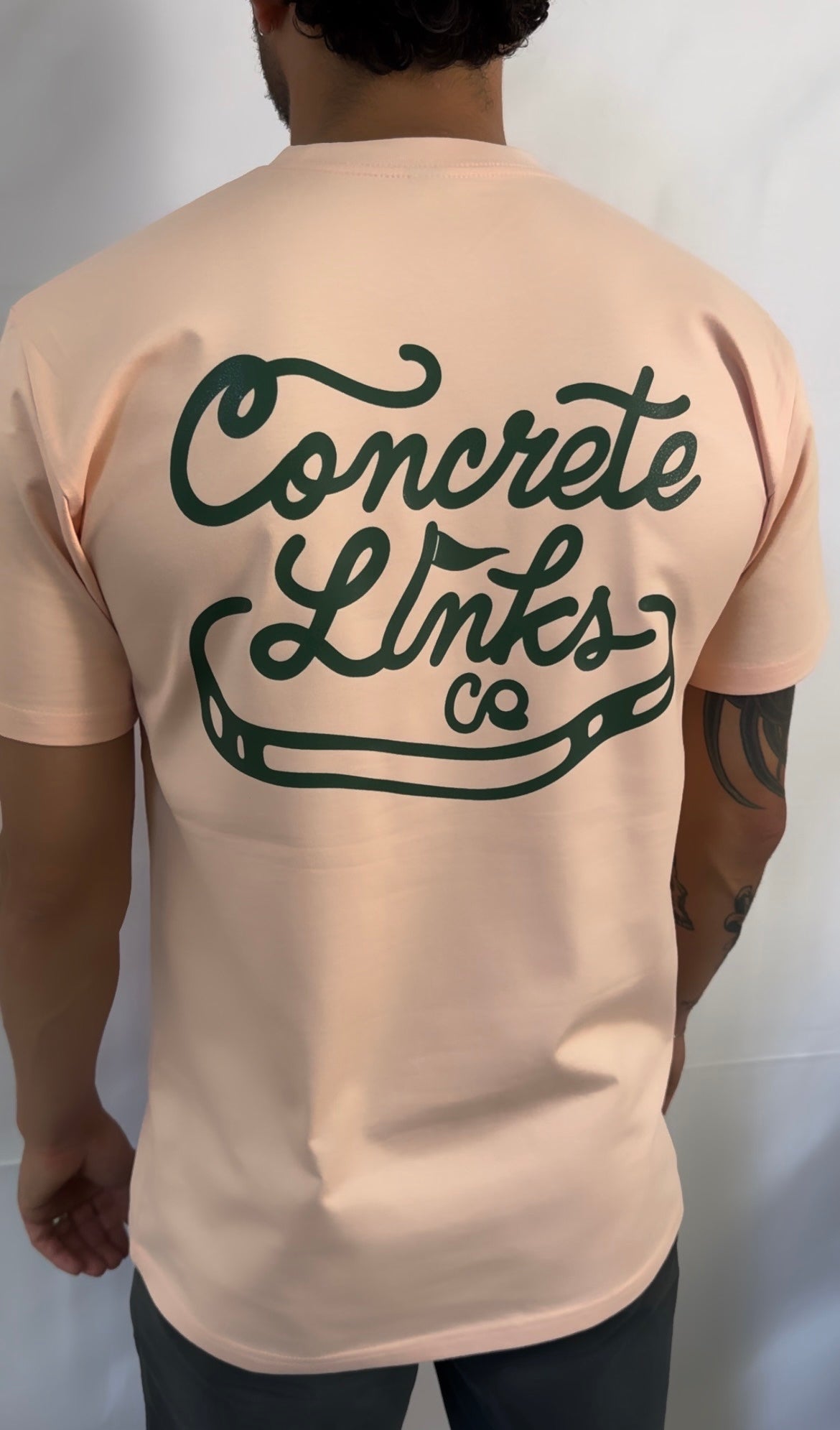 The Concrete Links Co "Classic Logo" tee in light pink & raching green