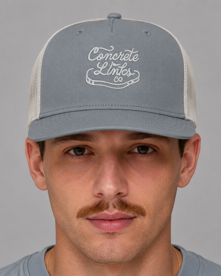 Man wearing a gray cap with 'Concrete Links' logo on a gray background