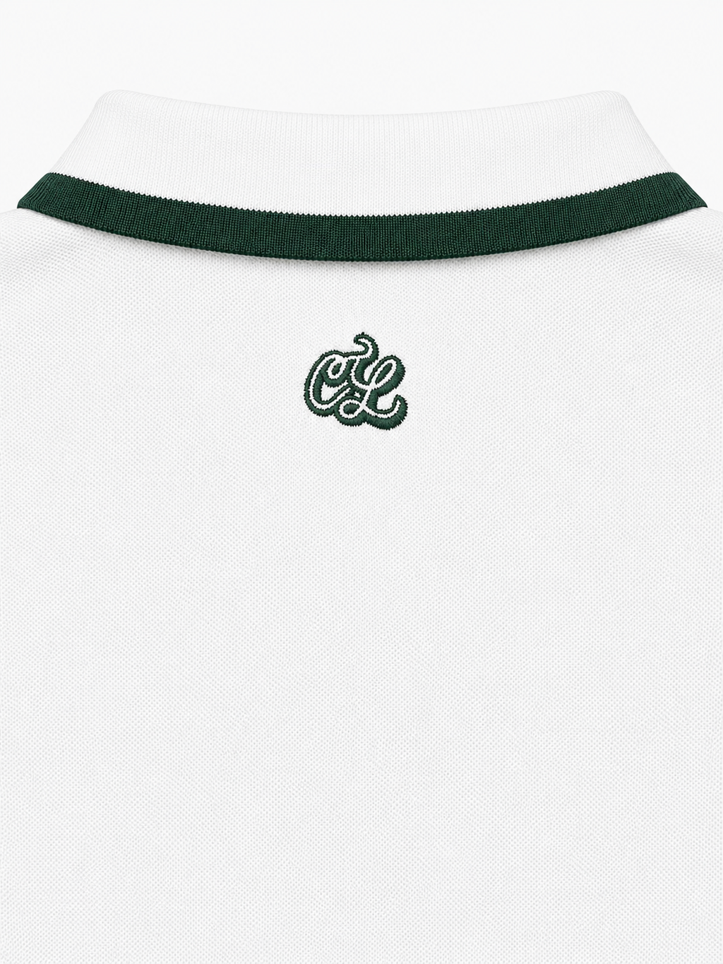 White polo shirt with green trim and logo on a white background