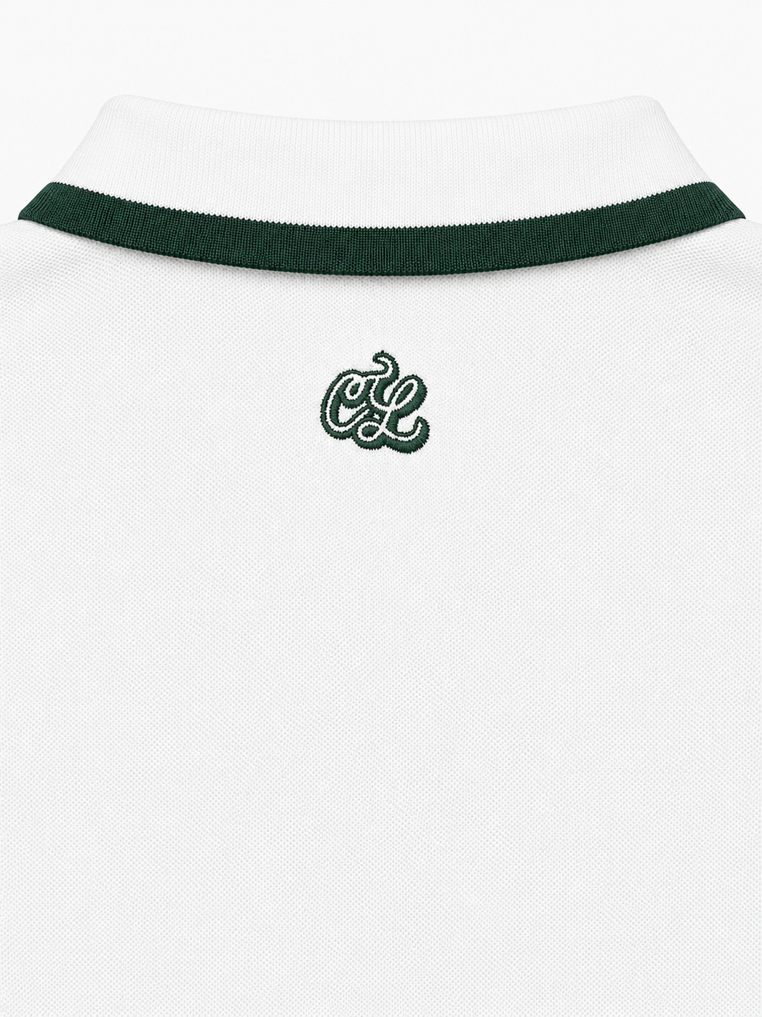 White polo shirt with green trim and logo on a white background