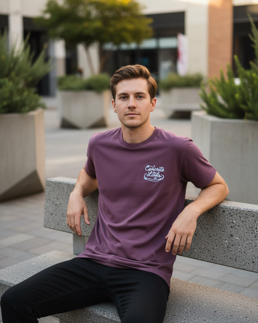 Maroon athletic shorts with a logo on a wooden floor